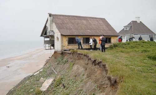 House hanging over eroded bank